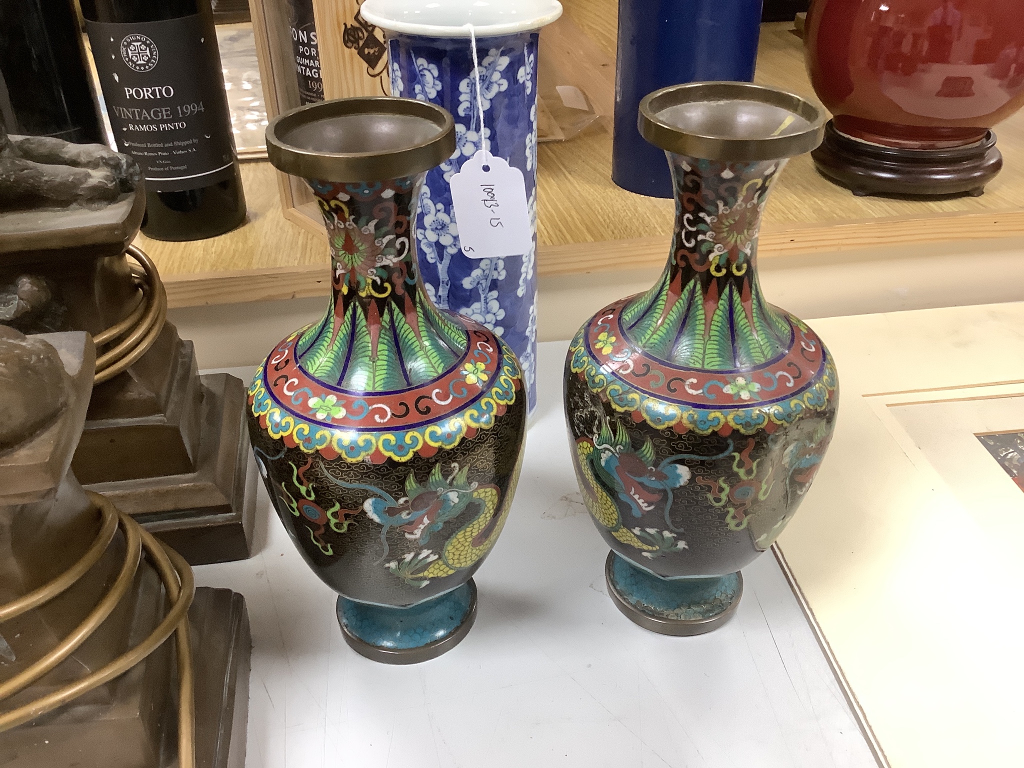 A group of Chinese porcelain and cloisonné enamel vases, tallest 25cm